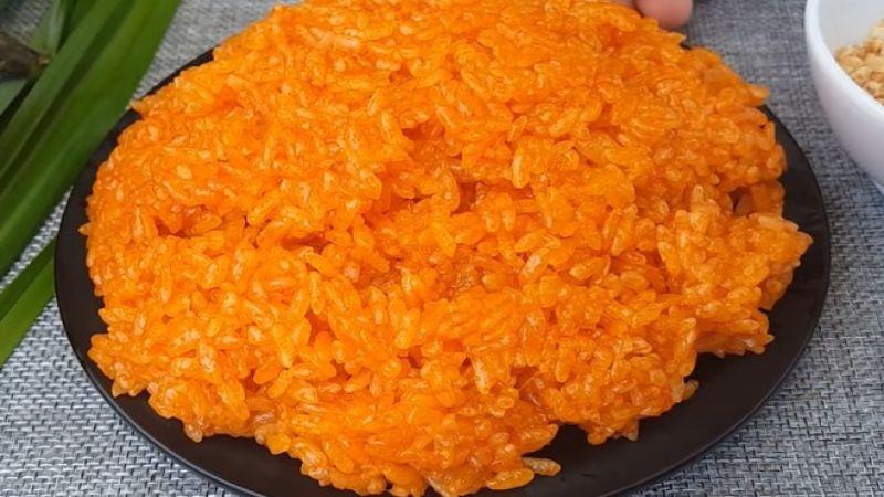 Cách nấu xôi gấc trong nồi cơm điện, xôi dẻo, thơm ngon, màu sắc tươi sáng và hấp dẫn.